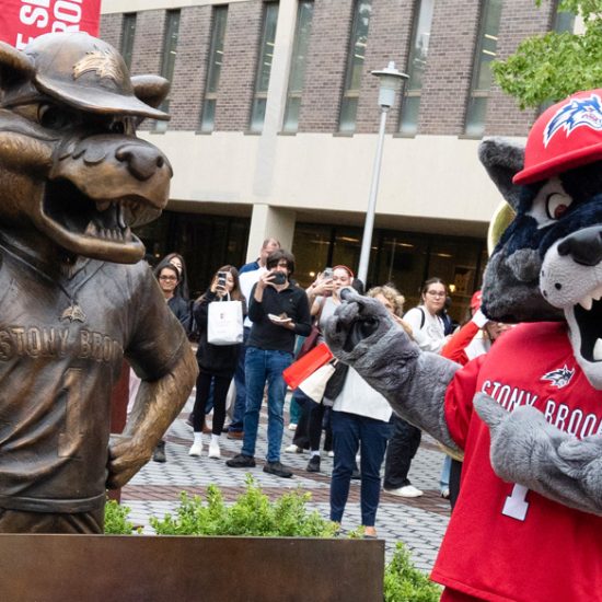 wolfie with bronze statue of his likeness