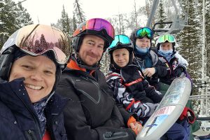 A family on a ski lift.